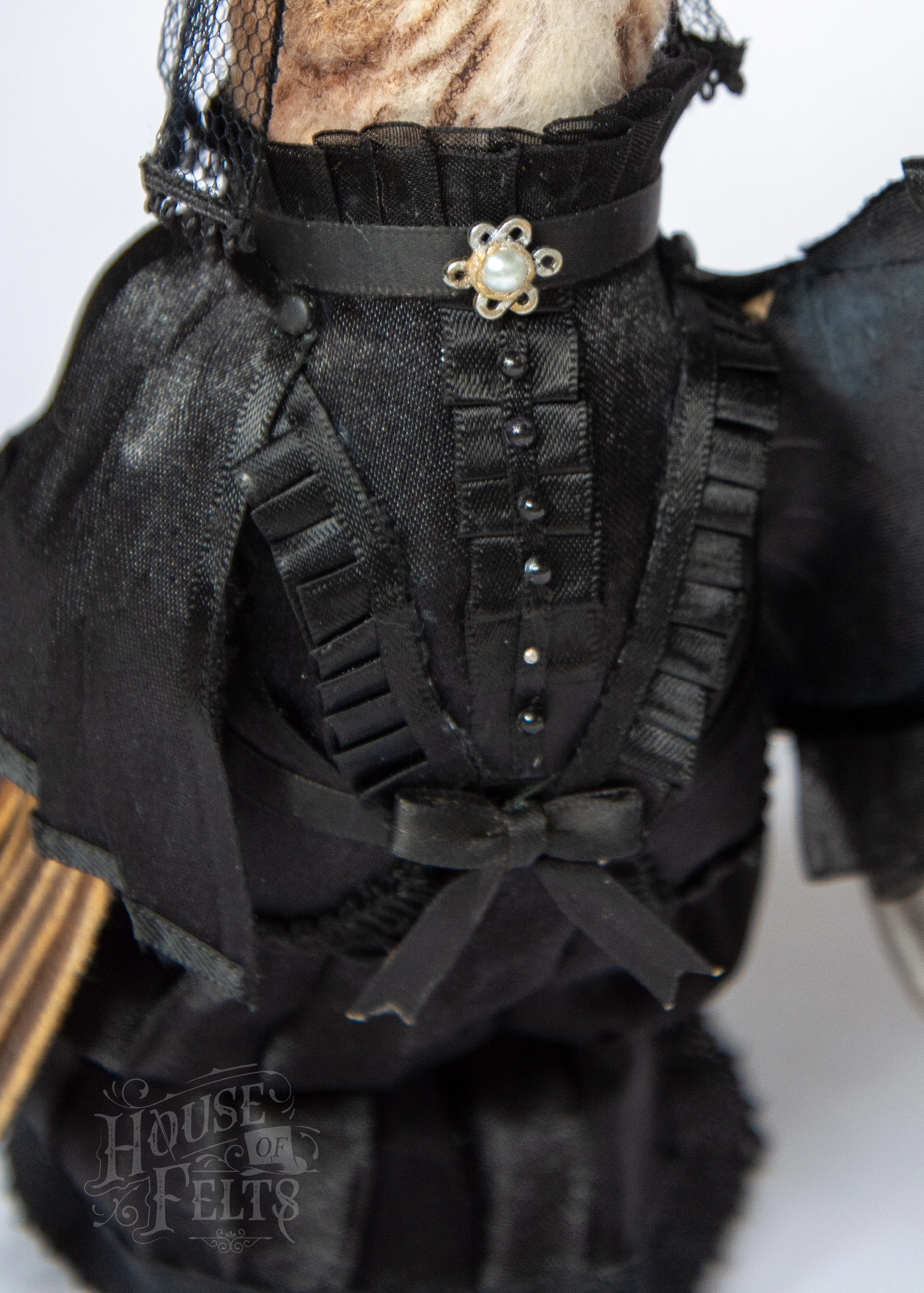 Details of miniature victorian mourning clothing for needle felted anthropomorphic bird